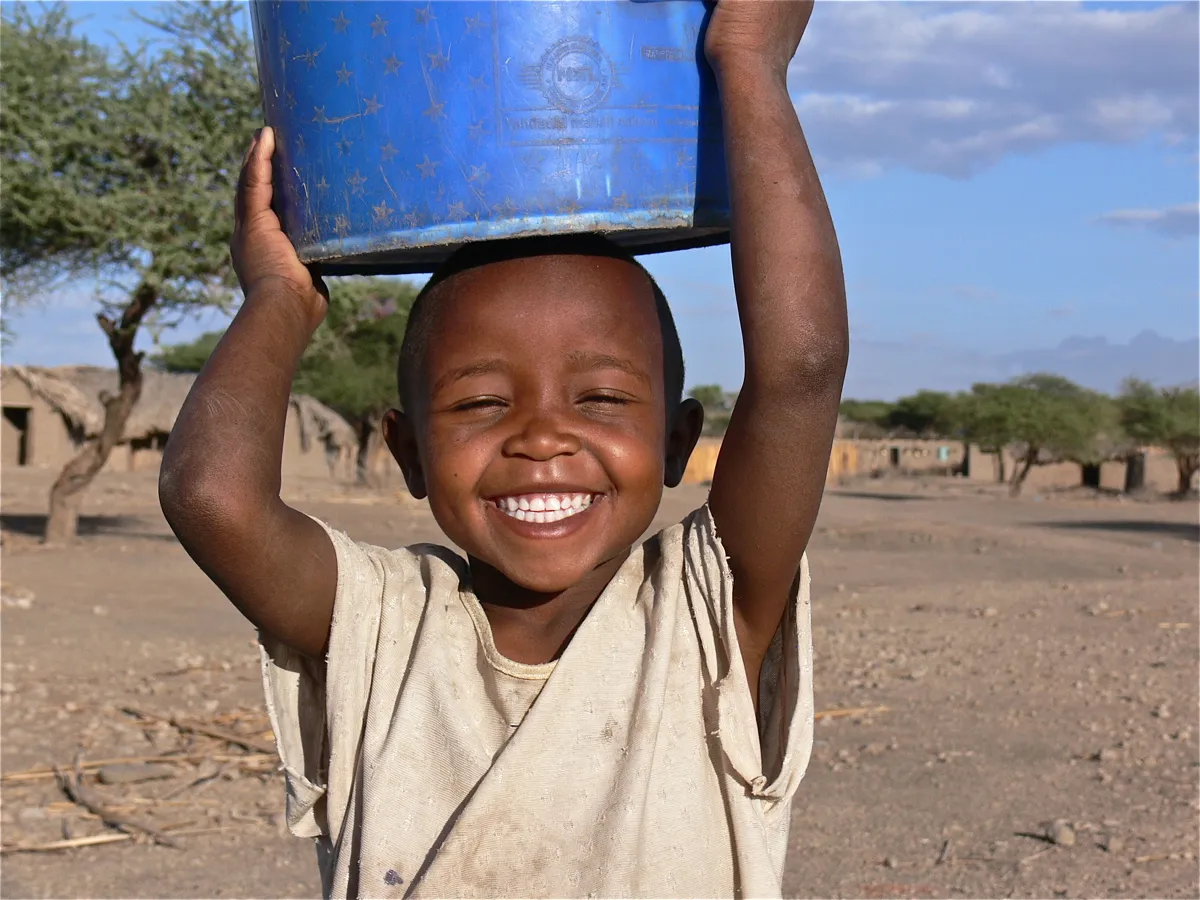 Hadzabe boy with water